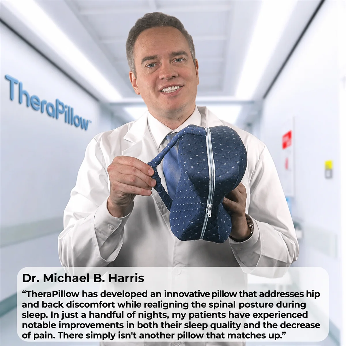 Dr. Michael B. Harris holding the TheraPillow Spine Alignment Pillow